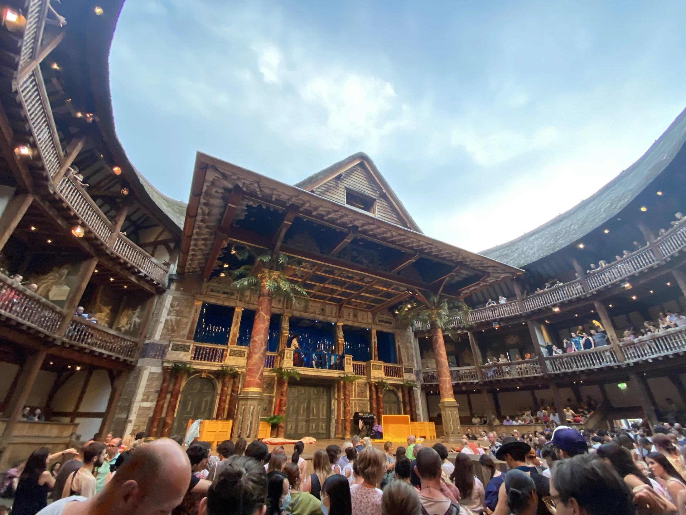 Audience members gathered around the stage at Shakespeare’s Globe in London